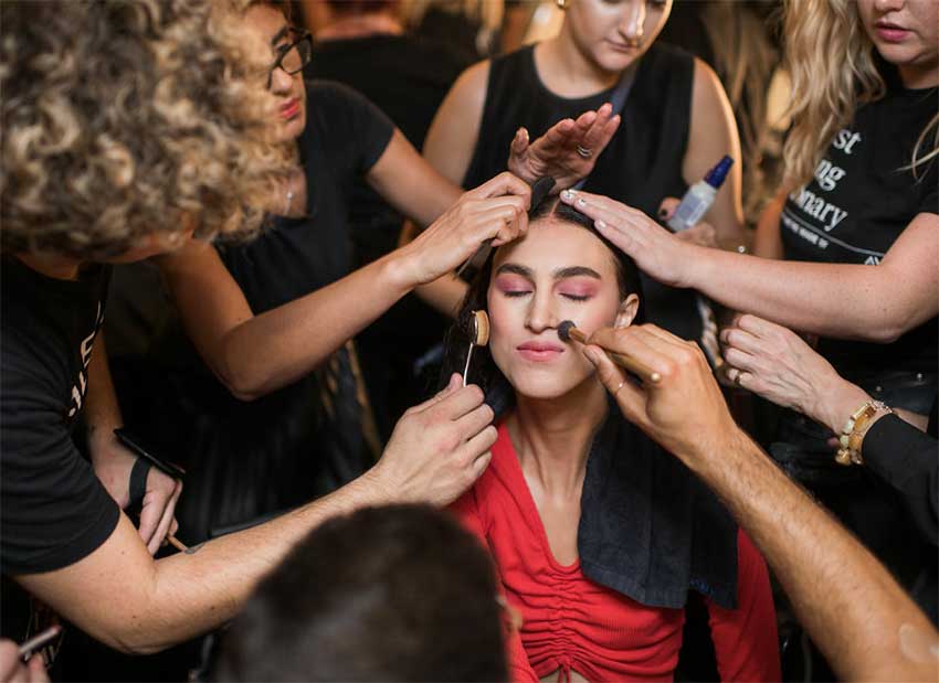 Career Opportunities Career Opportunities at Aveda Institute Maryland woman having her make up applied by many different Aveda Estheticians and Cosmetologists